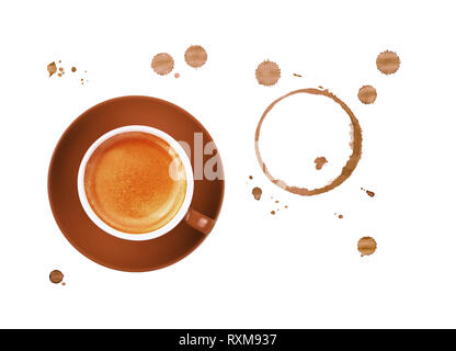 Brown cup full of espresso coffee on saucer, with ring coffee stains and drops isolated on white background, elevated top view, directly above Stock Photo