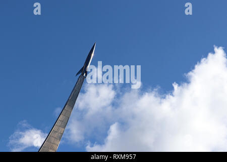 Monument to the Conquerors of space, silhouette of russian rocket against the cloudy sky. Museum of cosmonautics in Moscow, space exploration symbol Stock Photo