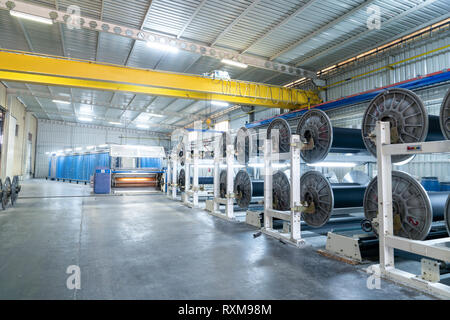 Interior of Textile factory with automated machinery.Concept of Industry and Technology