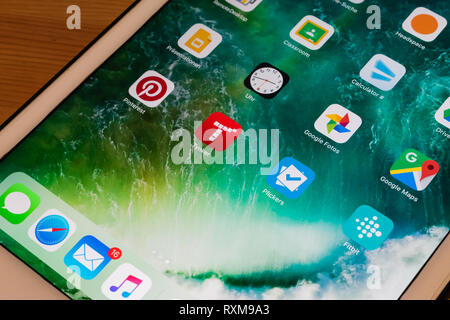 Tynker coding app for kids in the middle of white tablet sitting on tabletop Stock Photo