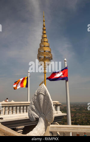Cambodia, Phnom Penh, Oudong, Cambodian national and Buddhist flags flying at Buddha’s eyebrow relic stupa Stock Photo