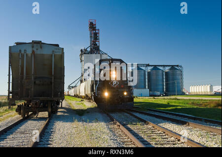 locomotive with rail hopper cars at an inland grain terminal, near Winnipeg, Manitoba, Canada Stock Photo