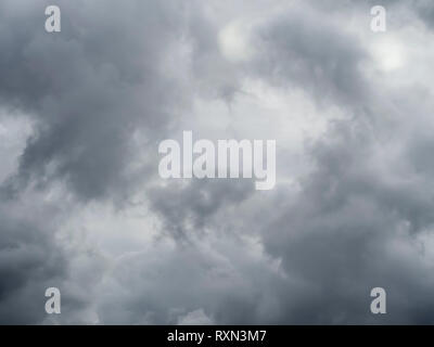 Grey sky, cloudy background, changeable weather natural clouds. Overcast but beautiful, dramatic sky effect. Stock Photo