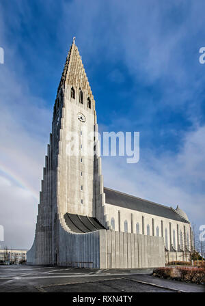 Reykjavik, Iceland, February 24, 2019: View of the tower and nave of the city's iconic Hallgrimskirkja church from the west against a mainly blue sky  Stock Photo