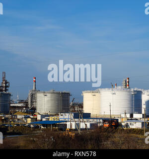 Refinery. Reservoirs for storage of refinery products. Rectification columns. Distillation columns, pipes and other equipment furnaces refinery. The o Stock Photo