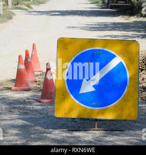 Sign of detour travel. Pit on the road. repair work Stock Photo