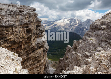 Sedimentary rocks of the Sella Group. In background the Marmolada massif. The Dolomites. Italian Alps. Europe. Stock Photo