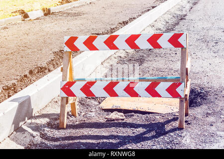 Road closed sign before the road construction. Toned photo Stock Photo