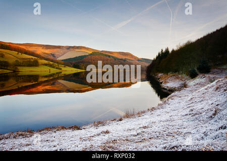 change of seasons, two Worlds in Ladybower Reservoir, Peak District Stock Photo