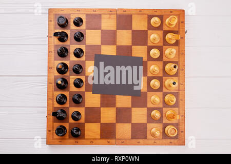 Classic wooden chess board with chess pieces. Stock Photo