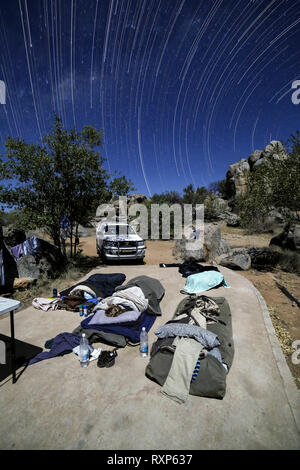 People sleeping in a camp site Stock Photo