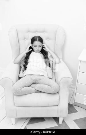 Happy little girl. Beauty and fashion. Childhood happiness. small kid fashion. International childrens day. small sad girl child with perfect hair. tired and nervous kid. headache. She is really cute. Stock Photo