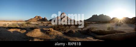 A panoramic image of sunrise over the Spitzkoppe, Namibia.