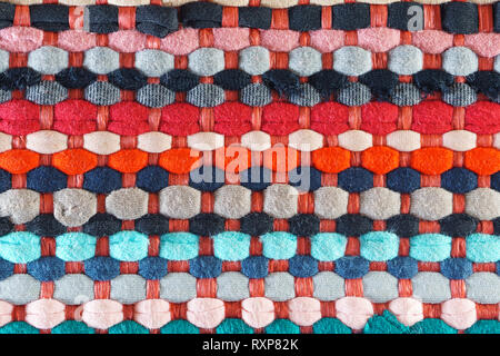 Multicolored Motley Rag Woven Rug Background. Domestic Cozy Rug Patchwork Fabrics Stock Photo