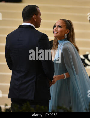 Jennifer Lopez (R) and Alex Rodriguez attend the 'Rei Kawakubo/Comme des Garcons: Art Of The In-Between' Costume Institute Gala at Metropolitan Museum Stock Photo