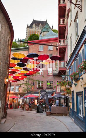 Umbrellas suspended over Rue Sous le Fort (Street Under the Fort) in the Lower Town of Old Quebec City, Province of Quebec, Canada