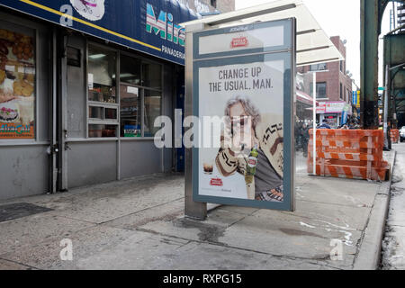 An advertisement for Stella Artois beer featuring Jeff Bridges dressed as and quoted to sound like the Dude from the Big Lebowski. Stock Photo