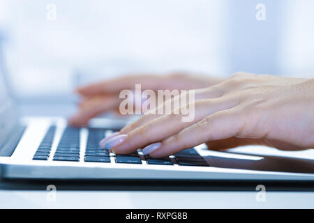 Closeup of businesswoman typing on laptop computer Stock Photo