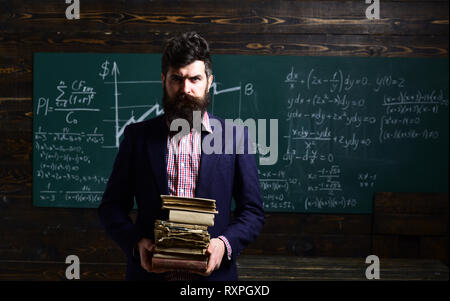 Taking notes is crucial to succeed as student. Charismatic teachers are great everybody loves them. graduation and people concept - successful tutor Stock Photo