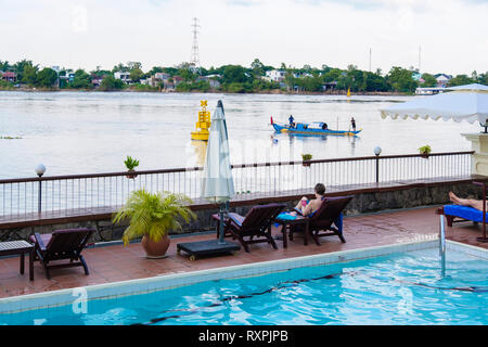 View from swimming pool in Victoria Chau Doc Hotel beside Hau River in Mekong Delta. Chau Doc, An Giang Province, Vietnam, Asia Stock Photo