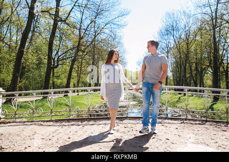 Happy future parents in summer day outdoor Stock Photo