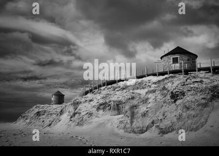 Sea sand dune mills. North of Portugal. Used infrared filter. Stock Photo