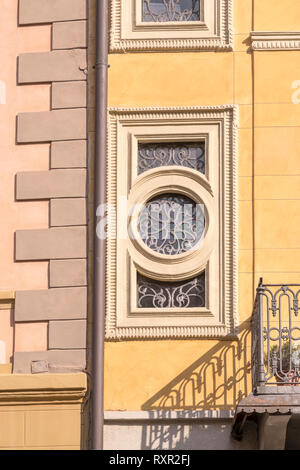 ornated wrought iron grating on old window in city center, shot in bright winter light at Cremona, Lombardy,  Italy Stock Photo