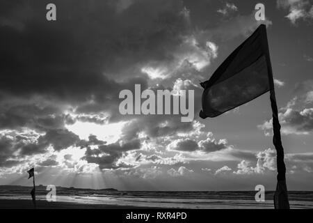 RNLI Flags Red and Yellow with dramatic sky Stock Photo