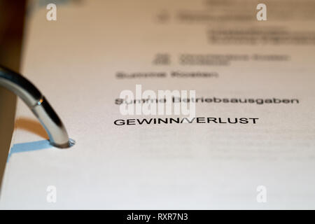 File folder with the sales figures on a desk Stock Photo