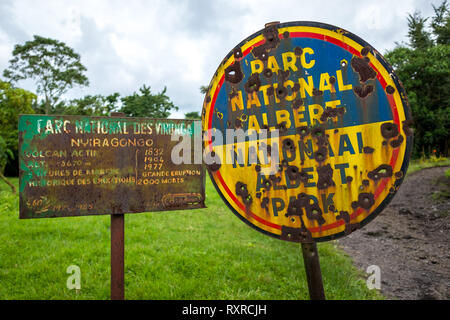 Bullet holes in a sign at Virunga National Park, Democratic Republic of Congo