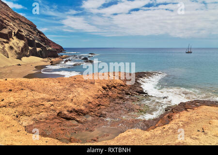 Atlantic Ocean with a sailing boat in the scene from La Tejita beach, Tenerife, Canary Islands, Spain. Stock Photo