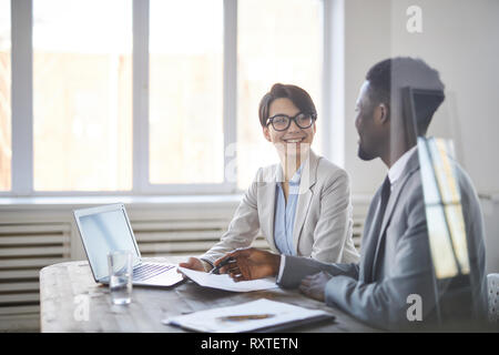 Colleagues discussing papers Stock Photo