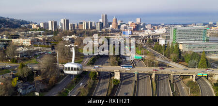 The cable car is full of riders exploring Portland via aerial transportation Stock Photo