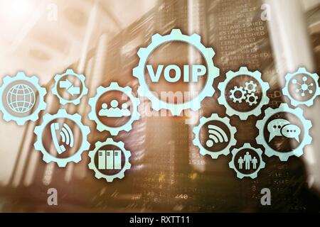 VoIP Voice over IP on the screen with a blur background of the server room. The concept of Voice over Internet Protocol. Stock Photo