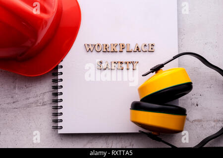 Construction helmet is a symbol of safety in the workplace. Set of tools. Safety concept Selective focus Stock Photo