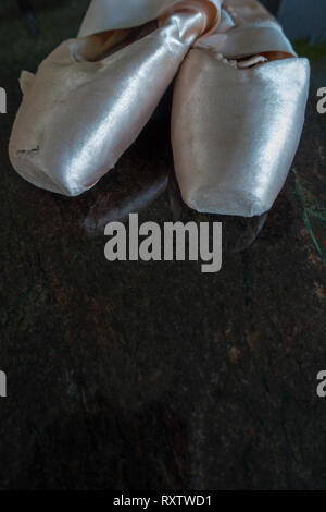 Classical Ballet pointe shoes, Ballerinas and Pointe Shoes on a marble floor Stock Photo