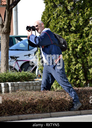 Man taking a picture using a  professional digital camera Stock Photo