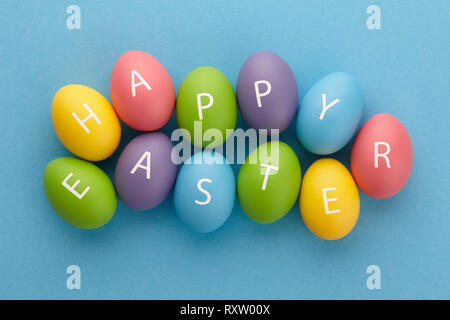 Painted eggs arranged in Happy Easter greeting Stock Photo