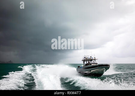 Marine Interdiction agents with U.S. Customs and Border Protection Air and Marine Operations (AMO) on board a Coastal Interceptor Vessel (CIV) with a maximum speed of 58 knots and range of 402 miles. See description for more information. Stock Photo