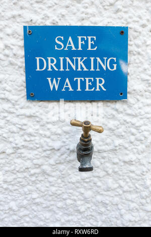 Safe Drinking Water tap and sign outside the Bridge of Orchy Hotel on the West Highland Way, Bridge of Orchy, Argyll, Scotland, UK Stock Photo