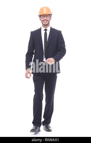 businessman in a protective helmet confidently stepping forward Stock Photo