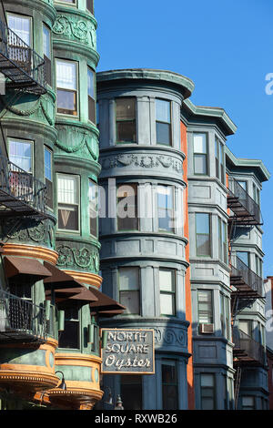 Succession of 19th century apartment buildings with rounded and angular bay fronts on North Street in Boston's Little Italy district, Boston, Massachusetts, USA Stock Photo