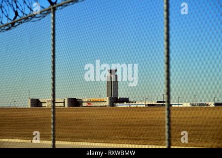 Chicago, Illinois, USA. A security fence topped with barbed wire surrounding O'Hare International Airport. Stock Photo