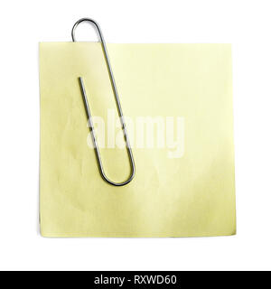 Note paper template for design with big metal paper clip over white. Clipping path Stock Photo