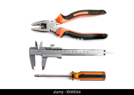Calipers, pliers, screwdriver over white, tech support or repare concept Stock Photo