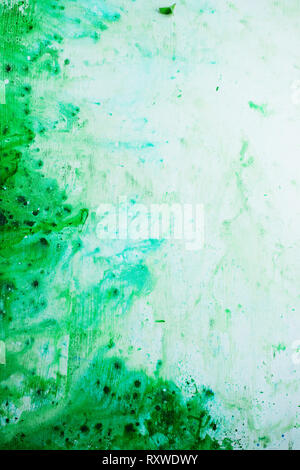 Green watercolor texture on a white background, acrylic base. Spring palette with copy space Stock Photo