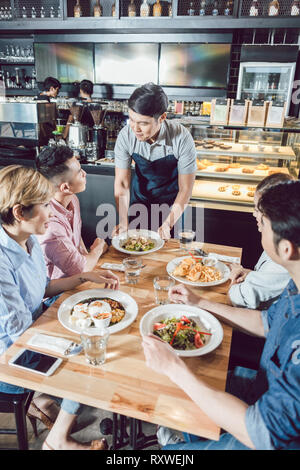 Waitering Chinese waiter serving dinner in elegant restaurant or Hotel Stock ...