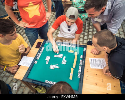 Moscow, Russia - August 09, 2018: Japanese festival in Moscow. Young people playing mahjong asian tile-based game. Table gambling top view Stock Photo