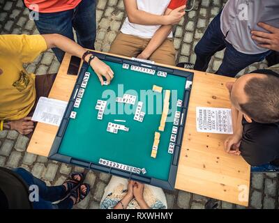 People Playing Mahjong Asian Tile-based Game. Table Gambling top view Stock Photo