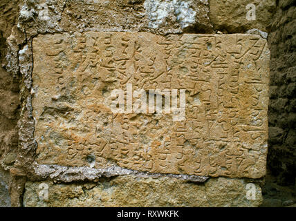 Hatra (al-Hadr), Iraq: a limestone block at the northern gate inscribed in Aramaic, the written language of the Arab rulers of the C1stBC caravan city Stock Photo